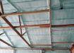 pole barn ceiling covered with spray foam
